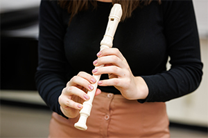 Student playing a recorder